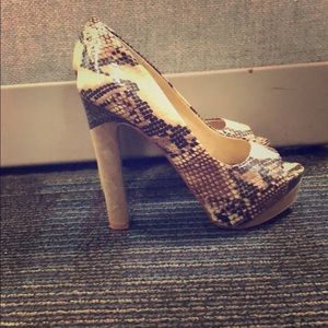 Peep toe snake skin heels